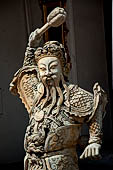 Bangkok Wat Pho, chinese style door guardians of the gallery of the eastern courtyard of the temple compund. 